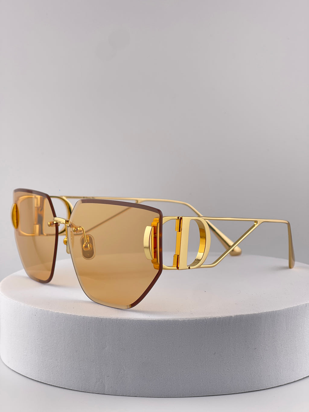 Dior square sunglasses with warm brown gradient lenses and gold-tone details