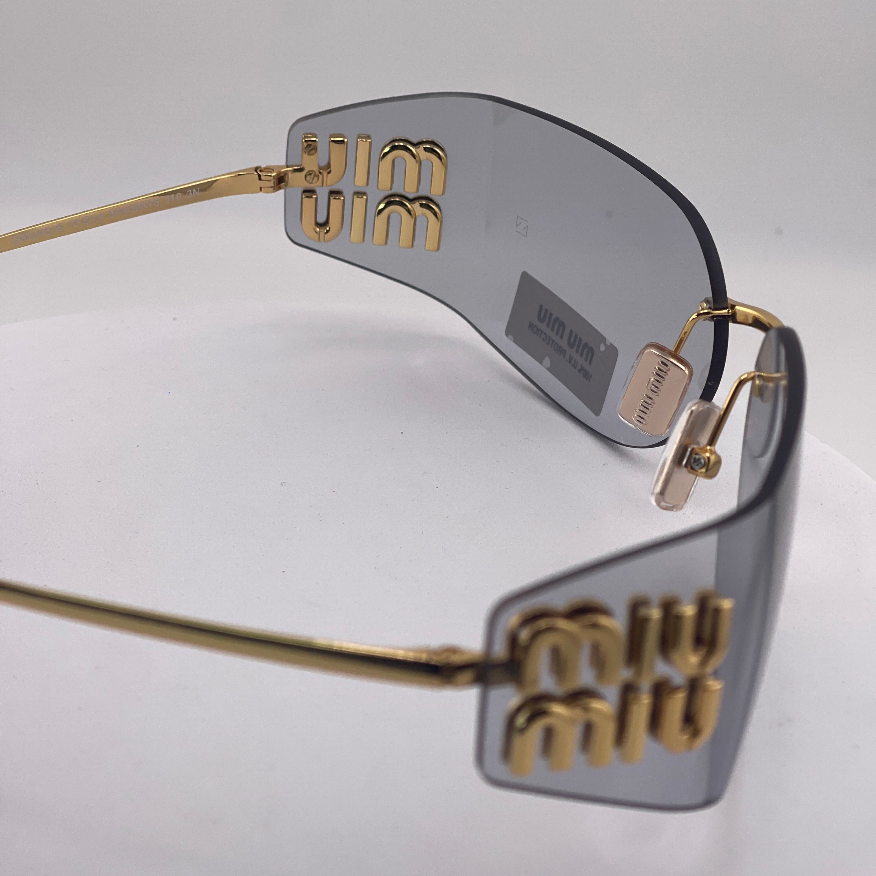 Miu Miu MU 54YS Rimless Sunglasses – Gold Frame / light grey Lenses