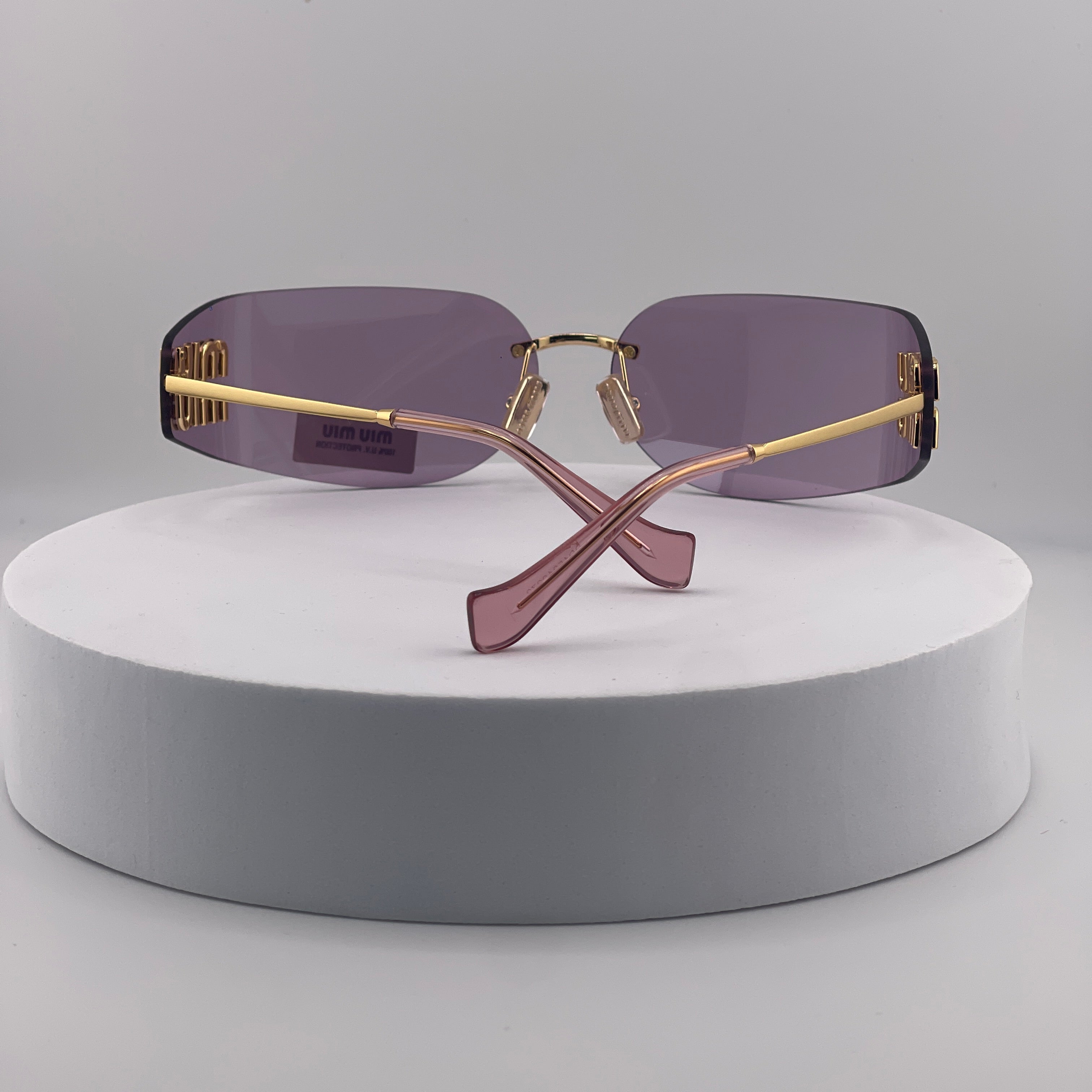 Miu Miu MU 54YS Rimless Sunglasses – Gold Frame / Purple Gradient Lens