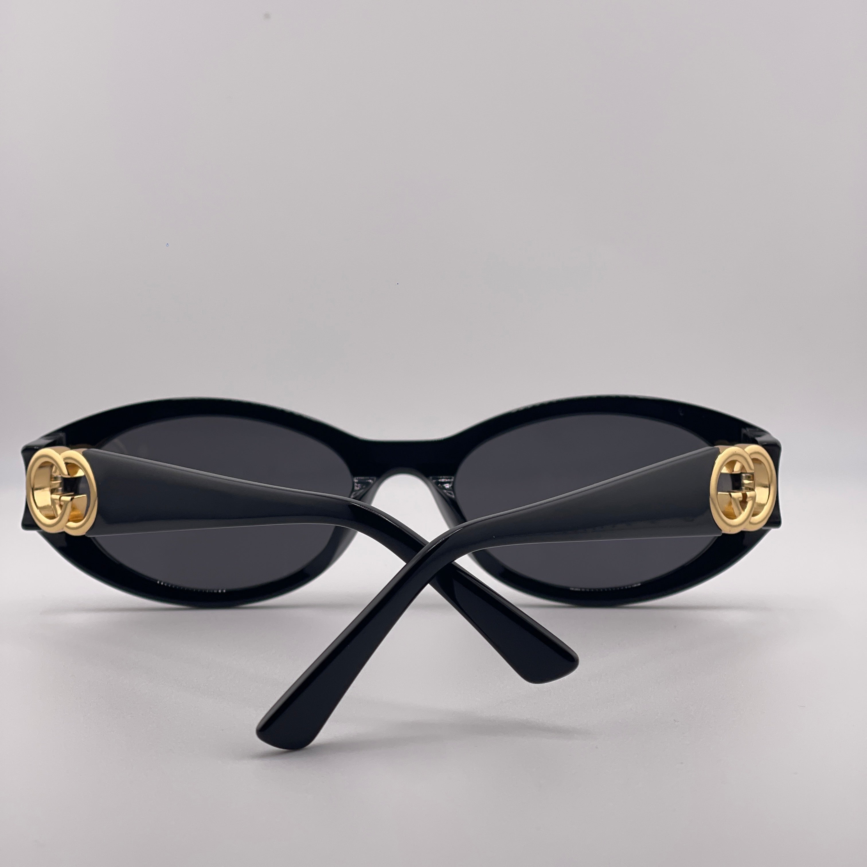 Gucci Oval Frame Sunglasses – Black & Gold