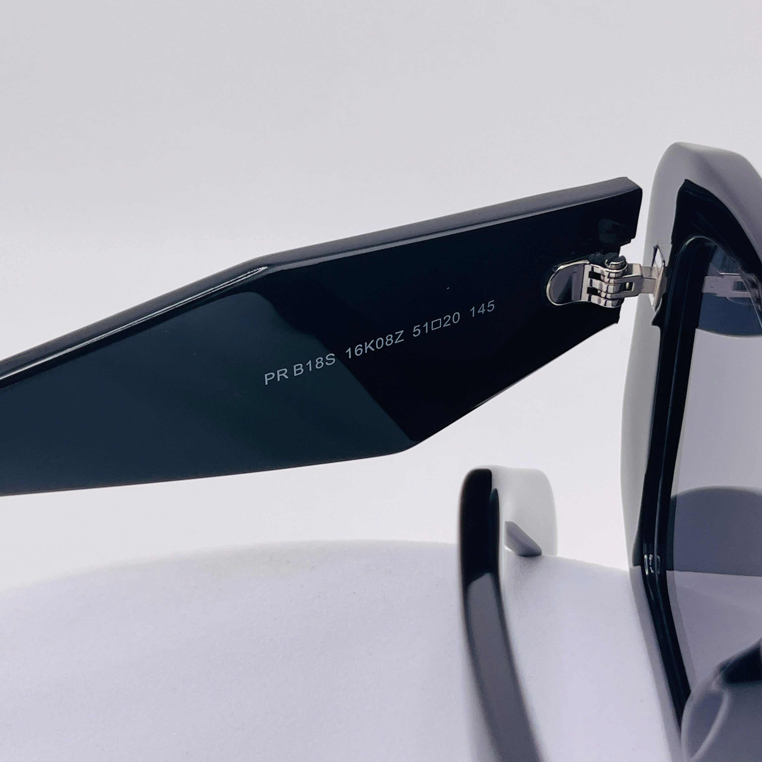 Prada Symbole Sunglasses – Black Acetate Frame